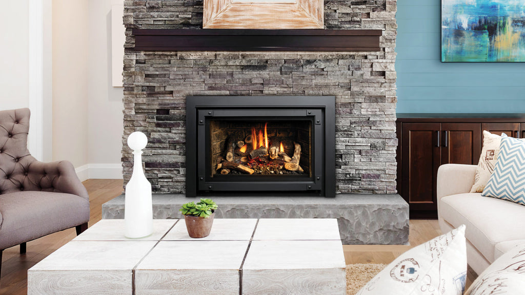 Beautiful living room interior with hardwood floors and fireplace in new luxury home. Couches at Right Angles are Opposite Armchairs and Fireplace with Surround that Stretches to Ceiling