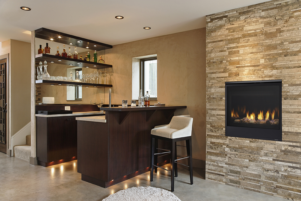 Wet bar and fireplace in modern home